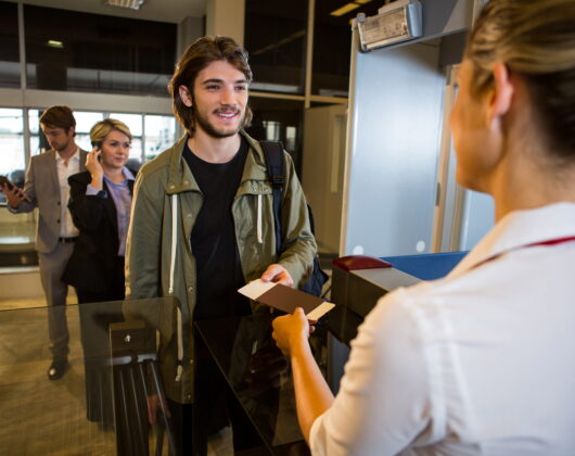UK airport immigration border control officer checking passport 2026 visa update